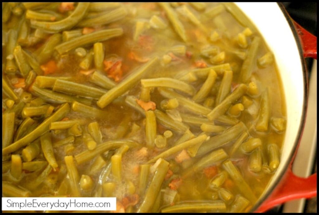 Green beans cooking in a Dutch oven