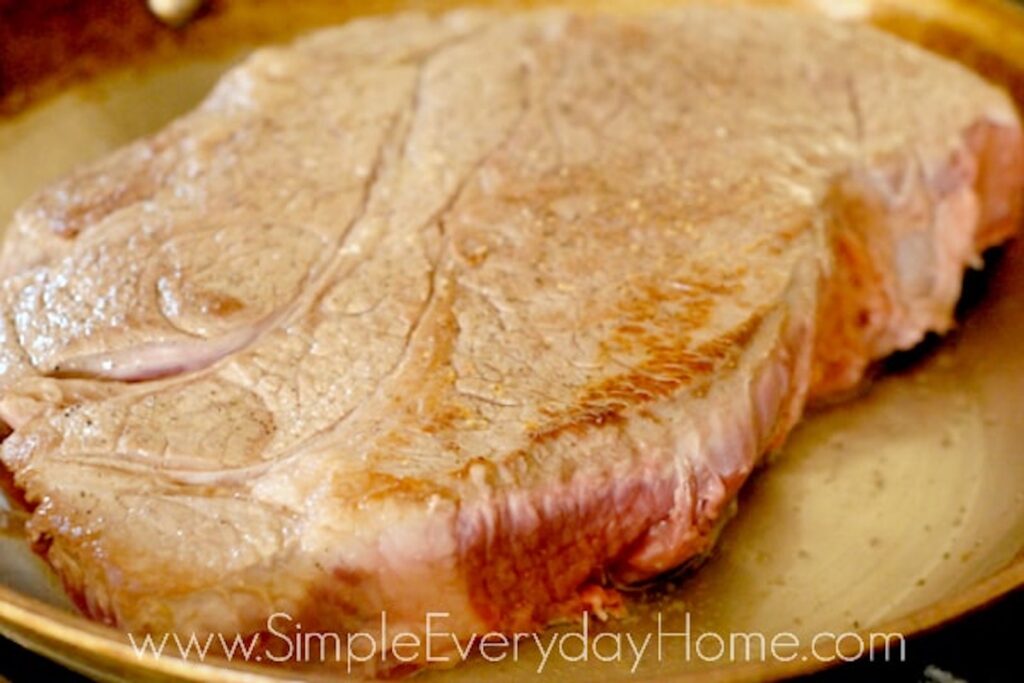 Beef roast getting brown in skillet