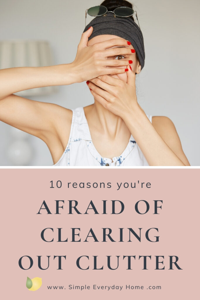 a woman peeking through her fingers that are covering her eyes with the words "10 reasons you're afraid of clearing out clutter"