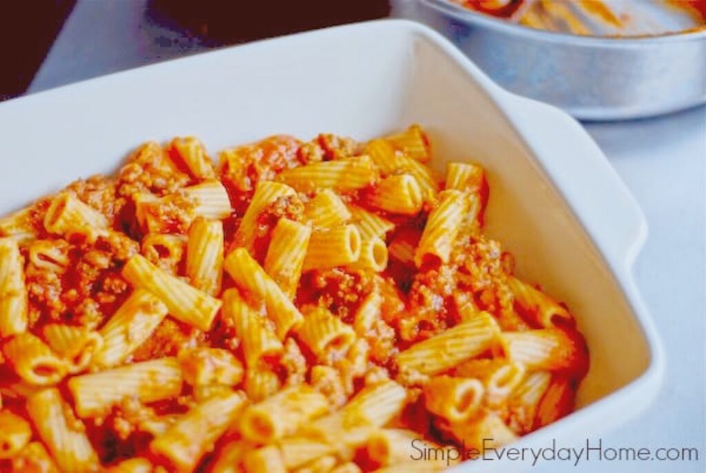 Rigatoni and sauce in baking dish