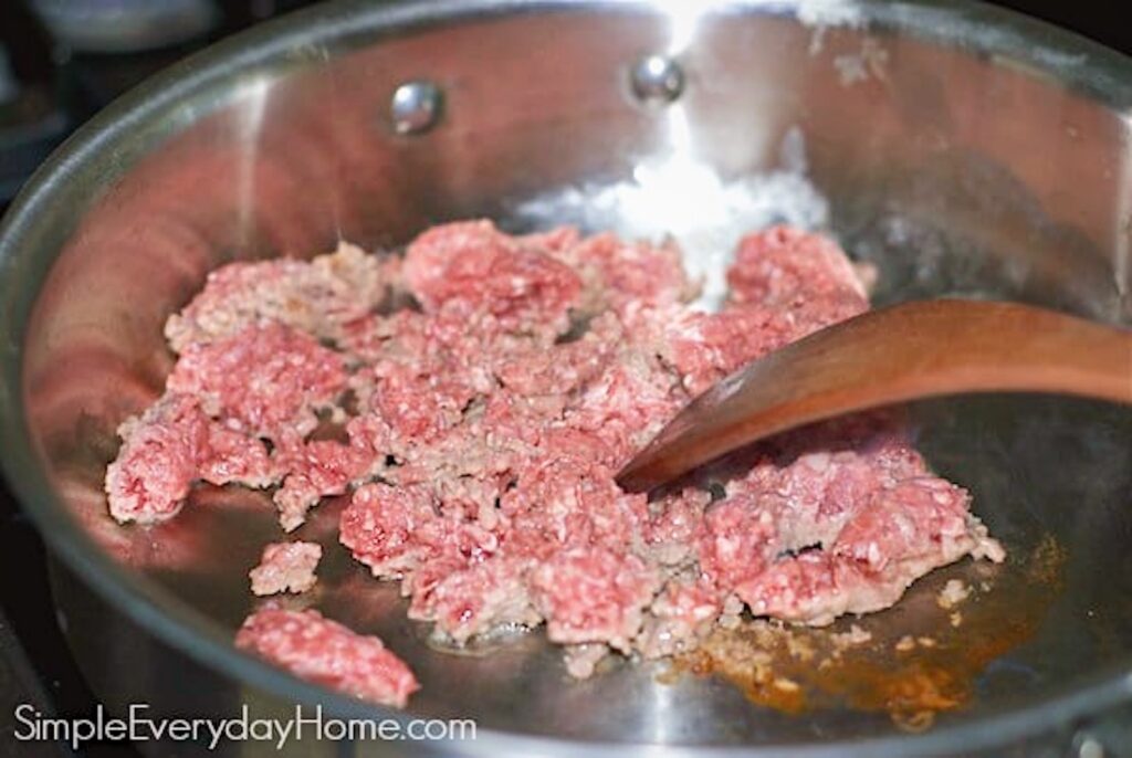 Ground beef cooking in skillet