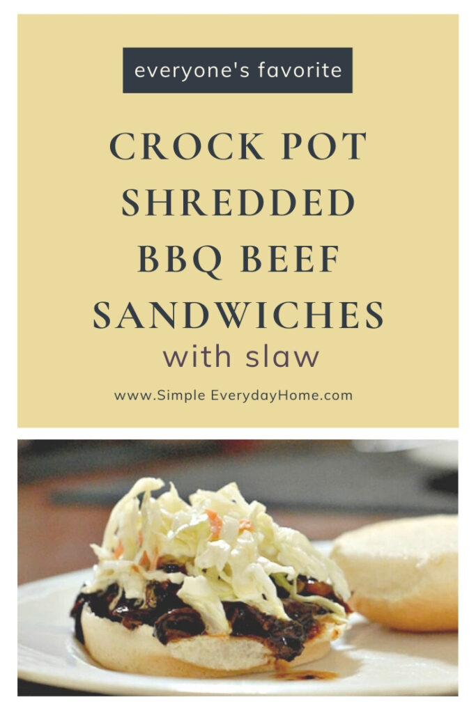 Barbecue been sandwich wiht the words Everyone's Favorite Crock Pot Shredded BBQ Beef Sandwiches with Slaw