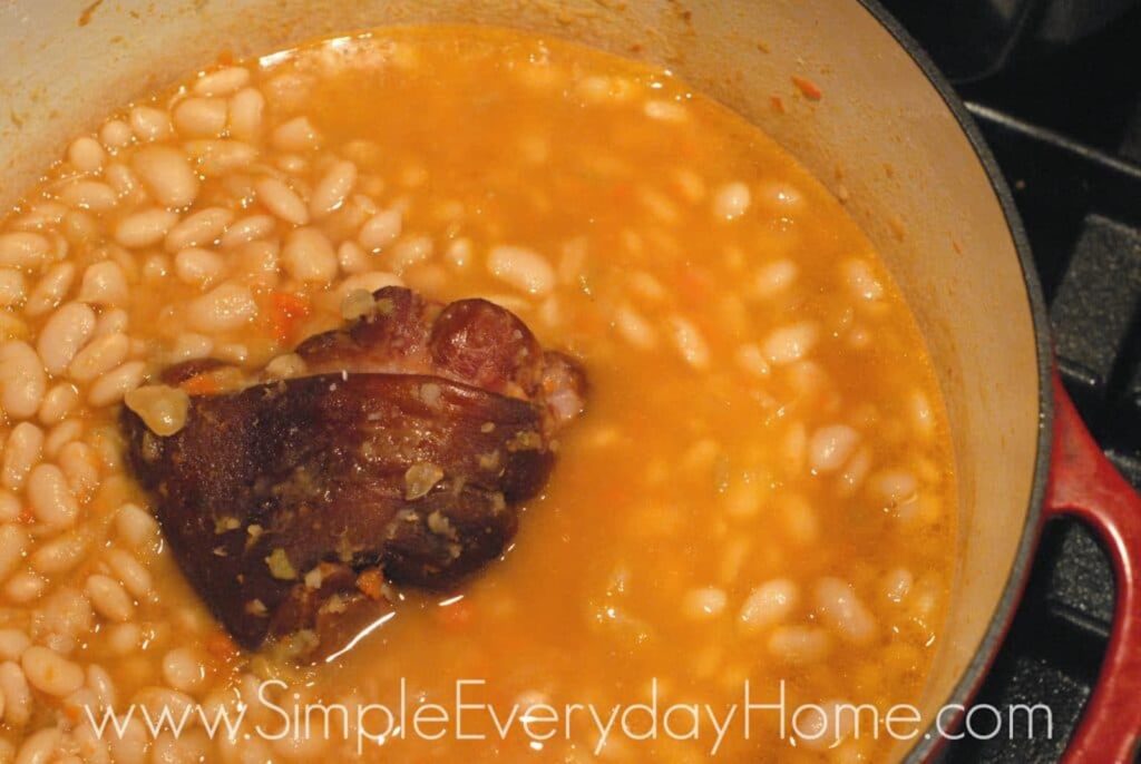 Beans and ham hock cooking in Dutch oven