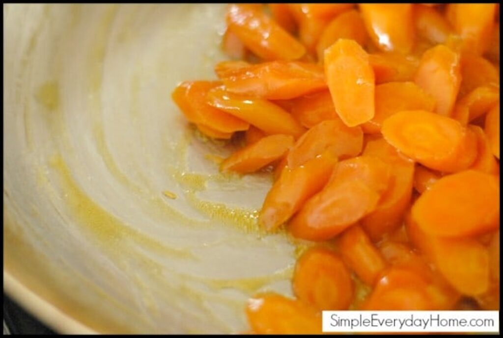 Carrots in pan swirled with glaze