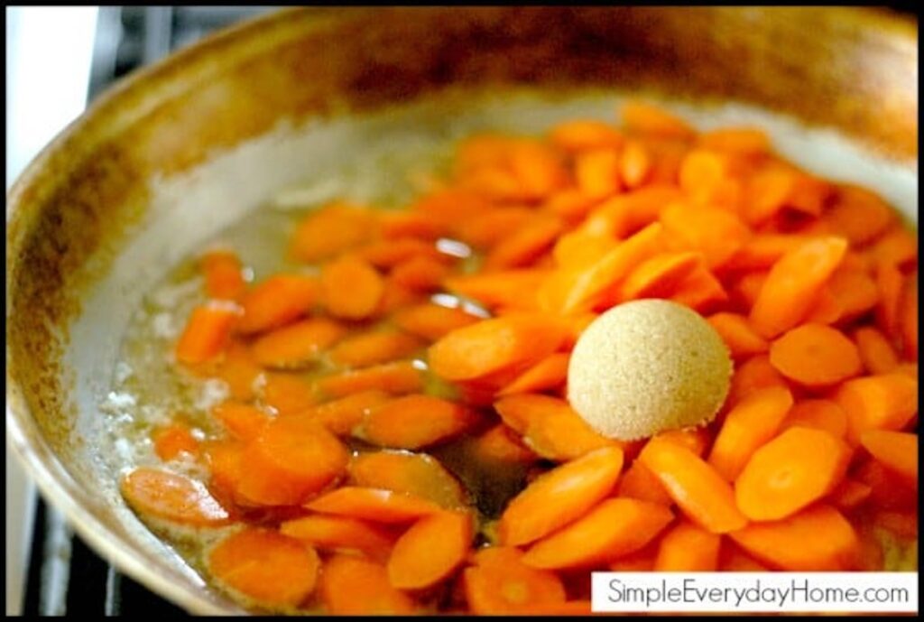 Carrots beginning to cook in pan with brown sugar