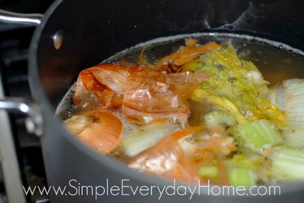 Vegetables cooking in stock pot