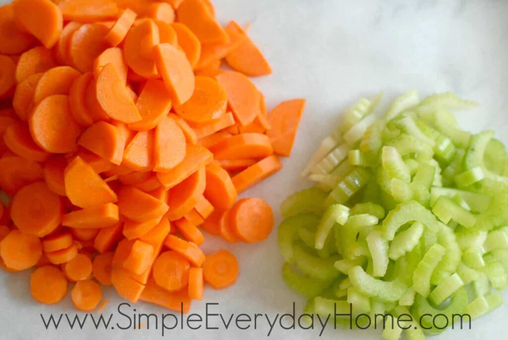 Sliced carrots and celery on counter