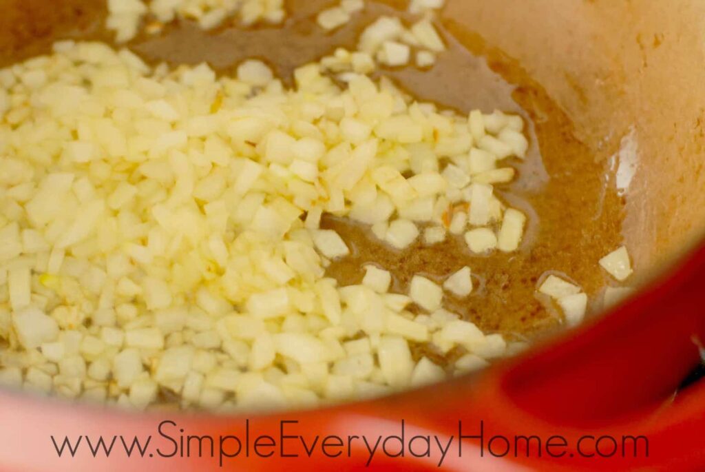 Diced onions cooking in Dutch Oven